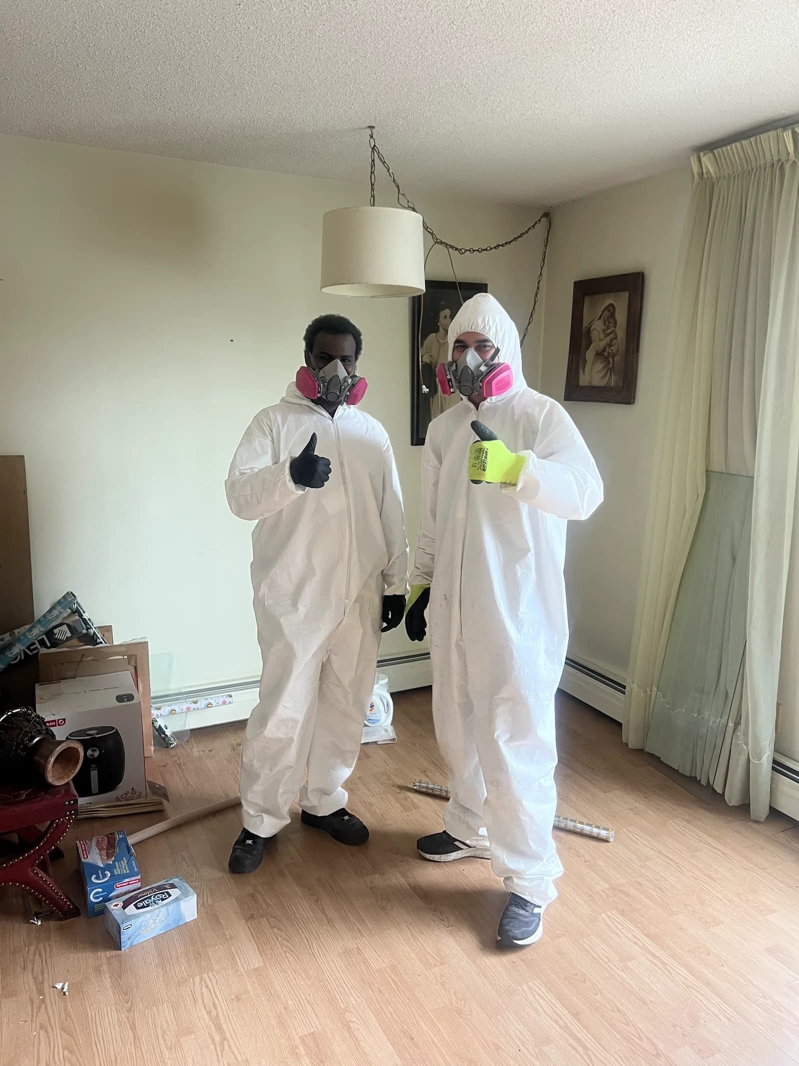 Pro-Pest cleanup crew in protective suits on a hoarding job