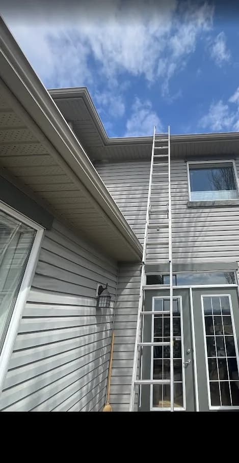 A ladder set for rooftop access on a Calgary commercial building