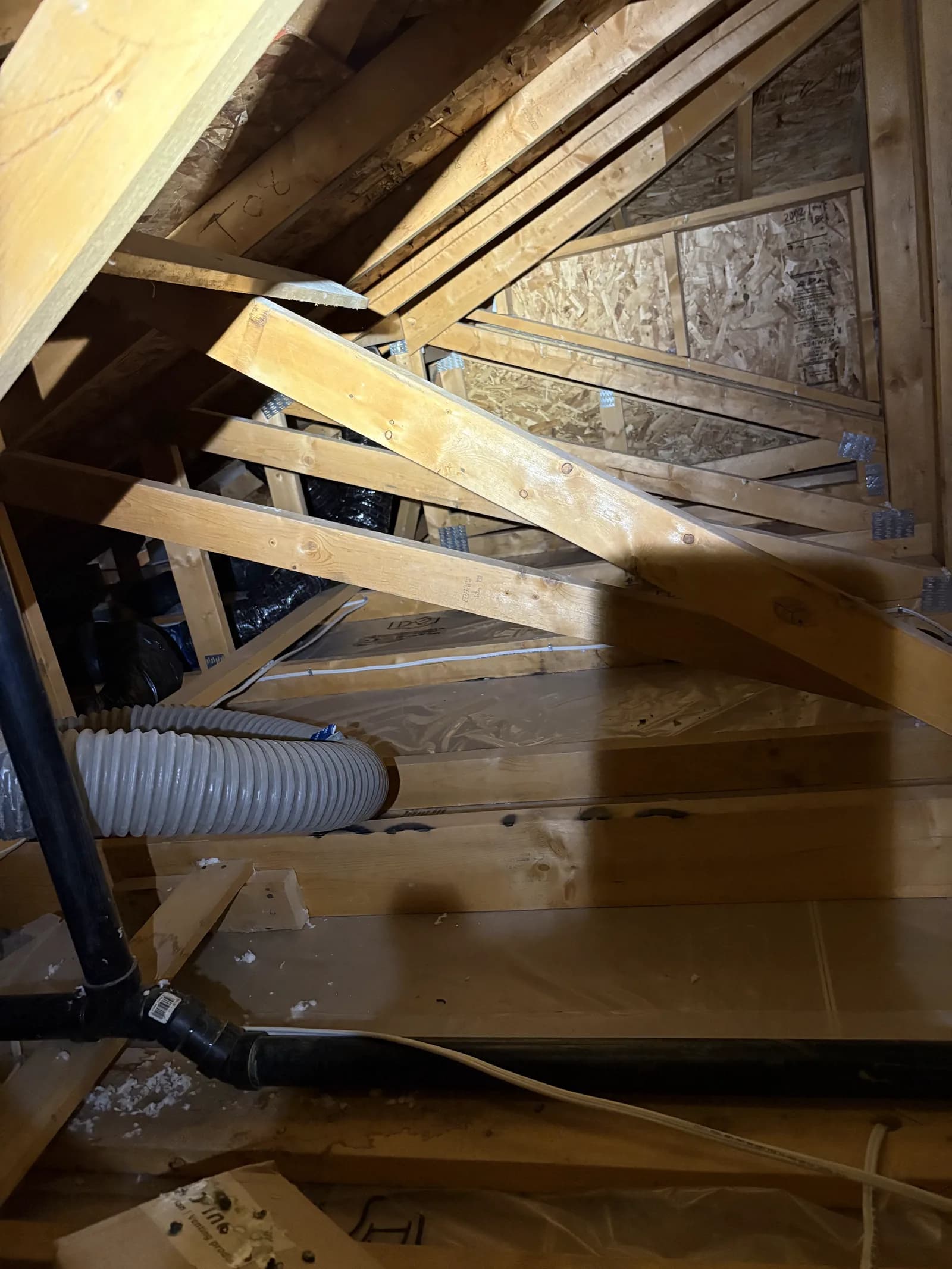 Attic framing and ventilation ahead of an insulation top-up